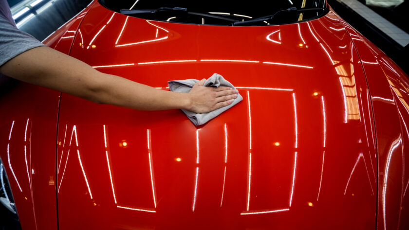 Ceramic coating being installed on a vehicle